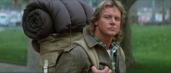 Movie still from “They Live” (1988), directed by John Carpenter – A person wearing a jacket; Close Up shot, Low angle