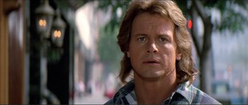 Movie still from “They Live” (1988), directed by John Carpenter – A person with long hair; Close Up shot, Low angle