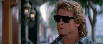 Movie still from “They Live” (1988), directed by John Carpenter – A person wearing sunglasses; Close Up shot, Low angle