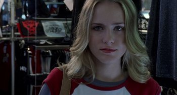 Movie still from “Thirteen” (2003), directed by Catherine Hardwicke – A person wearing a red and white shirt; Close Up shot, Over the shoulder angle
