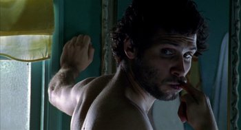 Movie still from “Thirteen” (2003), directed by Catherine Hardwicke – A shirtless man is looking into a mirror; Close Up shot, Low angle