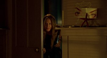 Movie still from “Thirteen” (2003), directed by Catherine Hardwicke – A woman standing at the door of a room; Medium shot, Over the shoulder angle