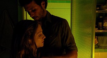 Movie still from “Thirteen” (2003), directed by Catherine Hardwicke – A man and a woman standing next to each other; Close Up shot, Overhead angle