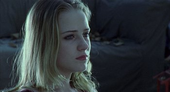 Movie still from “Thirteen” (2003), directed by Catherine Hardwicke – A woman with blonde hair and blue eyes looking to her left; Close Up shot, Low angle
