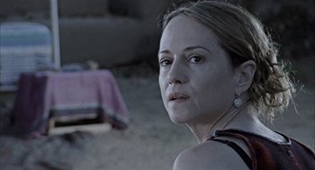 Movie still from “Thirteen” (2003), directed by Catherine Hardwicke – A person wearing a black shirt; Close Up shot, Over the shoulder angle