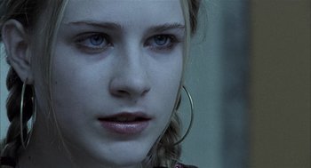 Movie still from “Thirteen” (2003), directed by Catherine Hardwicke – A woman's face with blue eyes; Close Up shot, Over the shoulder angle
