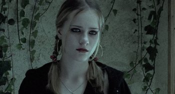 Movie still from “Thirteen” (2003), directed by Catherine Hardwicke – A young woman with pigtails wearing a black shirt; Close Up shot, Low angle