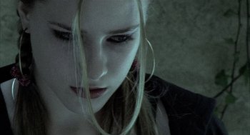 Movie still from “Thirteen” (2003), directed by Catherine Hardwicke – A person with long blonde hair; Close Up shot, Low angle