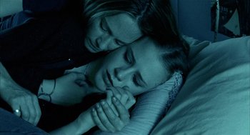 Movie still from “Thirteen” (2003), directed by Catherine Hardwicke – Two people are sleeping in a bed together; Close Up shot, Overhead angle