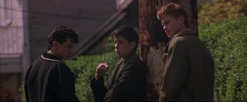 Movie still from “This Boy's Life” (1993), directed by Michael Caton-Jones – A group of young men standing next to each other; Medium shot, Low angle