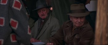 Movie still from “This Boy's Life” (1993), directed by Michael Caton-Jones – A man and a woman sitting next to each other; Close Up shot, Low angle