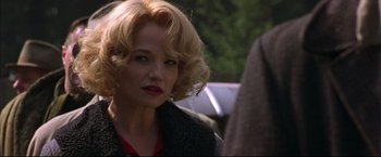 Movie still from “This Boy's Life” (1993), directed by Michael Caton-Jones – A person wearing a red shirt; Close Up shot, Over the shoulder angle