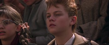Movie still from “This Boy's Life” (1993), directed by Michael Caton-Jones – A person wearing a sweater; Close Up shot, Low angle
