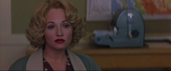 Movie still from “This Boy's Life” (1993), directed by Michael Caton-Jones – A person with blonde curly hair; Close Up shot, Over the shoulder angle