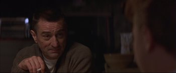 Movie still from “This Boy's Life” (1993), directed by Michael Caton-Jones – A person sitting in a room; Close Up shot, Low angle