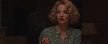 Movie still from “This Boy's Life” (1993), directed by Michael Caton-Jones – A woman holding a spoon in her hand; Close Up shot, Low angle