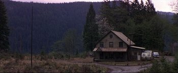 Movie still from “This Boy's Life” (1993), directed by Michael Caton-Jones – An old house in the middle of a forest; Extreme Wide shot, High angle