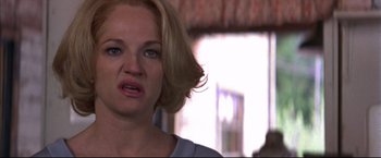 Movie still from “This Boy's Life” (1993), directed by Michael Caton-Jones – A person with blonde hair; Close Up shot, Over the shoulder angle