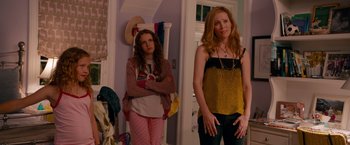 Movie still from “This Is 40” (2012), directed by Judd Apatow – Two women standing next to each other in front of a mirror; Medium shot, Over the shoulder angle