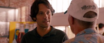 Movie still from “This Is 40” (2012), directed by Judd Apatow – A man talking to another man in front of a window; Close Up shot, Over the shoulder angle