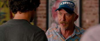 Movie still from “This Is 40” (2012), directed by Judd Apatow – An older man wearing a baseball cap talking to a younger man; Close Up shot, Over the shoulder angle