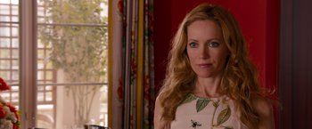 Movie still from “This Is 40” (2012), directed by Judd Apatow – A woman with long blonde hair wearing a white dress; Close Up shot, Over the shoulder angle
