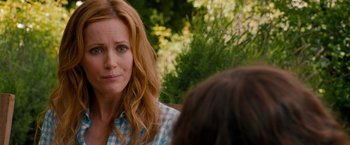 Movie still from “This Is 40” (2012), directed by Judd Apatow – A person sitting on a chair; Close Up shot, Over the shoulder angle