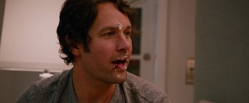Movie still from “This Is 40” (2012), directed by Judd Apatow – A person with food on his face; Close Up shot, Over the shoulder angle