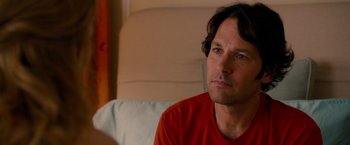 Movie still from “This Is 40” (2012), directed by Judd Apatow – A person sitting on a couch; Close Up shot, Over the shoulder angle