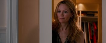 Movie still from “This Is 40” (2012), directed by Judd Apatow – A woman standing next to a white wall; Close Up shot, Over the shoulder angle