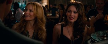 Movie still from “This Is 40” (2012), directed by Judd Apatow – Two beautiful women sitting next to each other in a bar; Close Up shot, Over the shoulder angle
