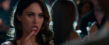 Movie still from “This Is 40” (2012), directed by Judd Apatow – A woman with long hair and teeth; Close Up shot, Over the shoulder angle