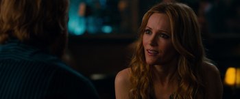 Movie still from “This Is 40” (2012), directed by Judd Apatow – A woman sitting in front of a man in front of a mirror; Close Up shot, Over the shoulder angle