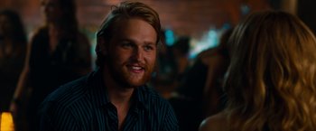 Movie still from “This Is 40” (2012), directed by Judd Apatow – A person with long hair and a beard; Close Up shot, Over the shoulder angle