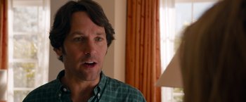 Movie still from “This Is 40” (2012), directed by Judd Apatow – A person wearing a plaid shirt; Close Up shot, Over the shoulder angle
