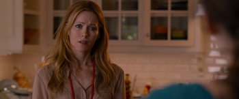 Movie still from “This Is 40” (2012), directed by Judd Apatow – A person wearing a necklace; Close Up shot, Over the shoulder angle