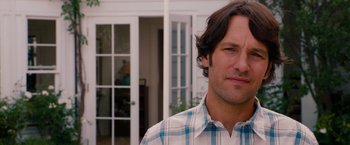 Movie still from “This Is 40” (2012), directed by Judd Apatow – A man standing in front of a house; Close Up shot, Over the shoulder angle