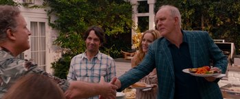 Movie still from “This Is 40” (2012), directed by Judd Apatow – A man shaking hands with another man outside; Medium shot, Over the shoulder angle