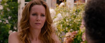 Movie still from “This Is 40” (2012), directed by Judd Apatow – A person with long red hair; Close Up shot, Over the shoulder angle