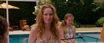 Movie still from “This Is 40” (2012), directed by Judd Apatow – A person sitting with another person; Close Up shot, Over the shoulder angle