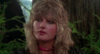 Movie still from “This Is Spinal Tap” (1984), directed by Rob Reiner – A person with long hair; Close Up shot, Low angle