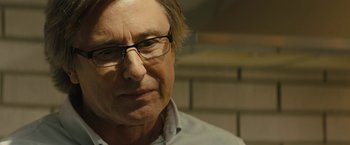 Movie still from “Those Who Wish Me Dead” (2021), directed by Taylor Sheridan – A person wearing glasses; Close Up shot, Over the shoulder angle
