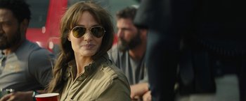 Movie still from “Those Who Wish Me Dead” (2021), directed by Taylor Sheridan – A person wearing a jacket and sunglasses; Close Up shot, Over the shoulder angle