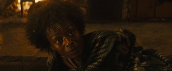 Movie still from “Those Who Wish Me Dead” (2021), directed by Taylor Sheridan – A person with a black and brown blanket on; Close Up shot, Over the shoulder angle