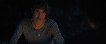 Movie still from “Those Who Wish Me Dead” (2021), directed by Taylor Sheridan – A person wearing a necklace; Close Up shot, Over the shoulder angle