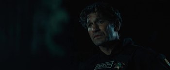 Movie still from “Those Who Wish Me Dead” (2021), directed by Taylor Sheridan – A person wearing a black shirt; Close Up shot, Over the shoulder angle