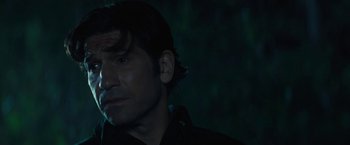 Movie still from “Those Who Wish Me Dead” (2021), directed by Taylor Sheridan – A person smoking a cigarette in the dark; Close Up shot, Over the shoulder angle