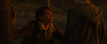 Movie still from “Those Who Wish Me Dead” (2021), directed by Taylor Sheridan – A woman in a brown jacket looking out a car window; Medium shot, Over the shoulder angle