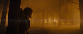 Movie still from “Those Who Wish Me Dead” (2021), directed by Taylor Sheridan – A man standing in the middle of a foggy forest; Extreme Wide shot, Over the shoulder angle