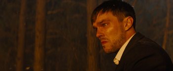 Movie still from “Those Who Wish Me Dead” (2021), directed by Taylor Sheridan – A person wearing a suit and tie; Close Up shot, Over the shoulder angle